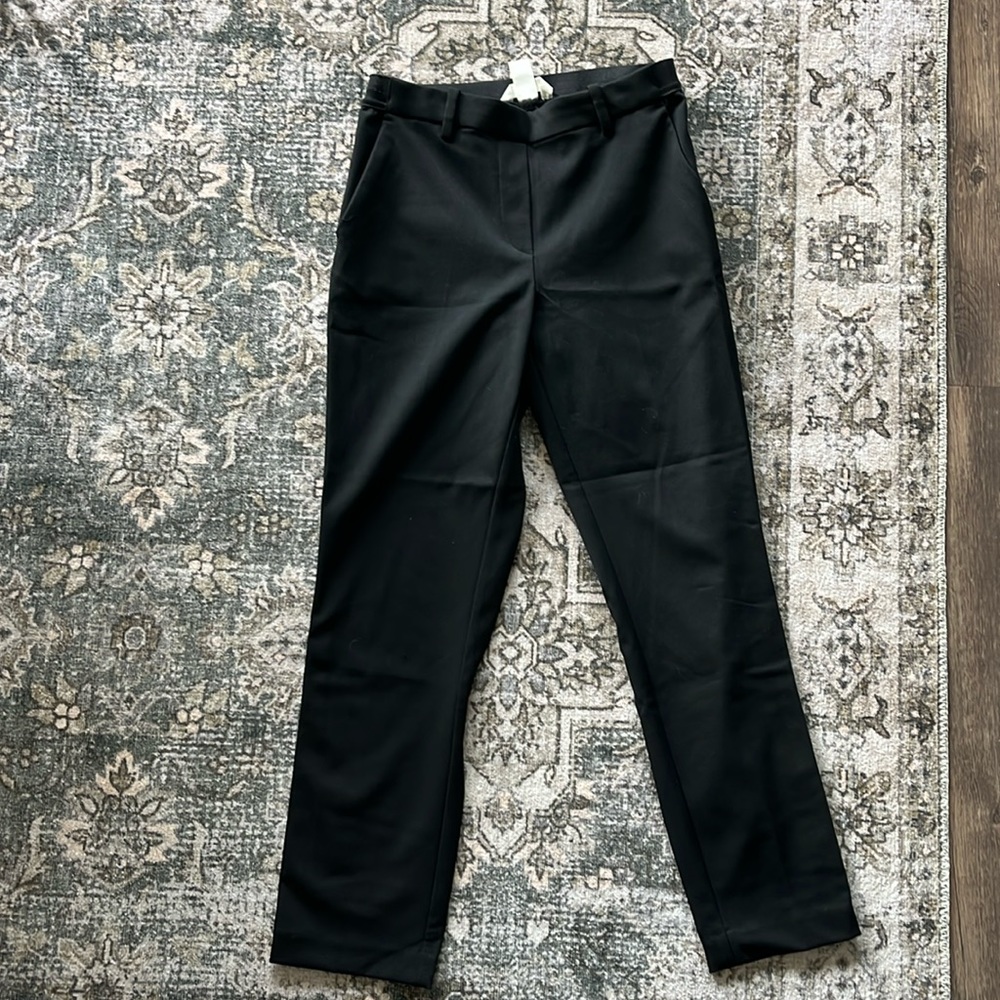 Black trousers with stripe down both pant legs. Size 4, never worn!